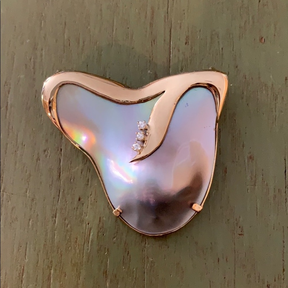 Mother of pearl, gold, and diamond brooch